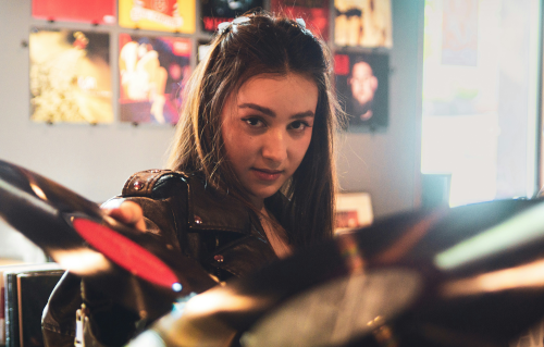 Girl in record store